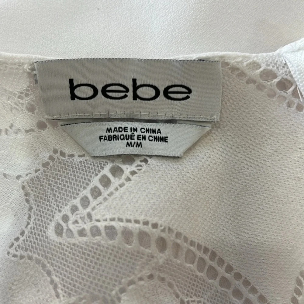 BEBE LWD Round Neck Sleeveless Ruffle hem Cute Short Dress. Lace Details. Size M